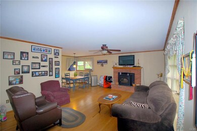 Living Room with Pellet Stove or Brick Fireplace