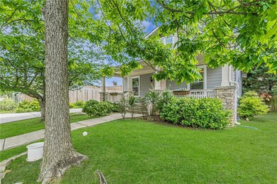View of front of property featuring stone siding and covered porch