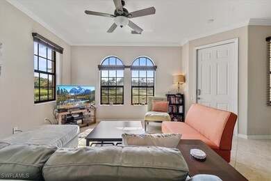 Living room featuring light tile patterned floors,