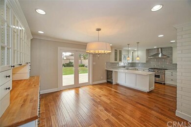 Grand dining room and kitchen that open to the bac