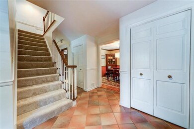 Ceramic tile entry loaded w/closets -hallway leads