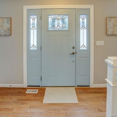Front door foyer w/ wood floor