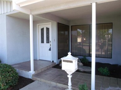 Welcoming front porch and garden area