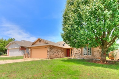 Single story home featuring a garage and a front l