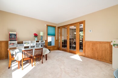 Living room can be an office or play room offering french glass doors to the dining room.