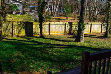 Fully fenced yard with beautiful mature trees.