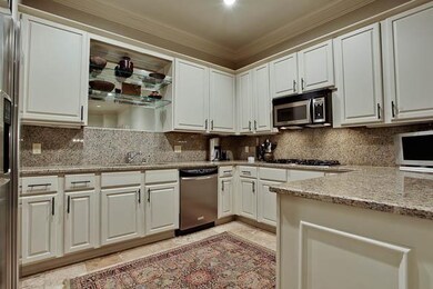 Granite, stainless steel appliances, dishes, cooki