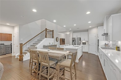Open concept with oversized dining area and laundry room