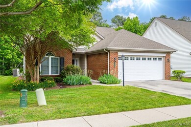 Front facade with a front yard and a garage