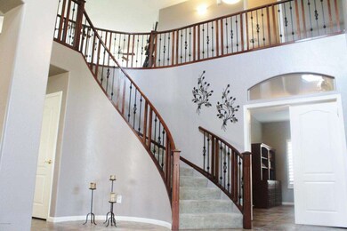 Grand curved stairway from foyer