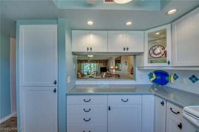 Features under cabinet lighting and 2 corner glass