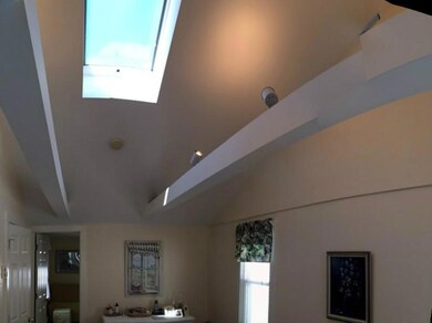 Living Room. Operable skylight with...