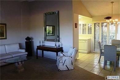 An alternate view of the living room and dining ar