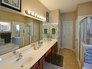 stand up shower, jacuzzi tub, dual sinks with plen