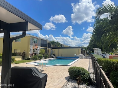 View of swimming pool featuring a patio and grilli