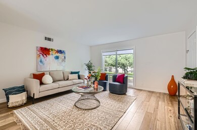 Living room featuring light wood-style floors and