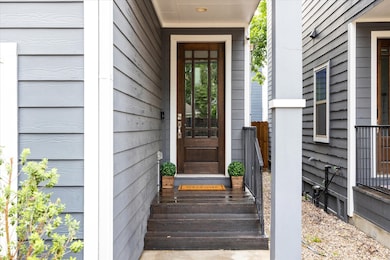 FRONT PORCH.  Covered to keep those parcels dry.   Also, being the last unit, this home is further from the street.  Passers by couldn't even see parcels placed here making it more secure.