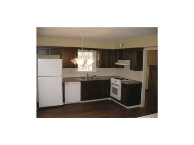 Eat-in Kitchen features new flooring and counter t