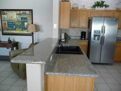 Property Photo. Bar separating family room and kit