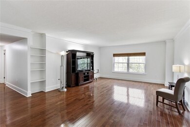 Spacious Living Room with wood floors and freshly