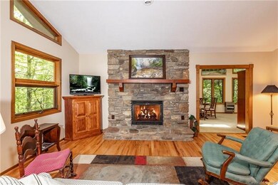 The propane, rock fireplace anchors the great room