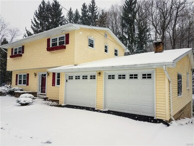 Side view showcasing two-car garage.