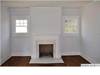 Cottage-style fireplace adds to the coziness of th