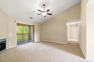 Unfurnished living room featuring carpet floors, c