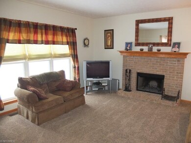 Family room with fireplace and lots of natural lig