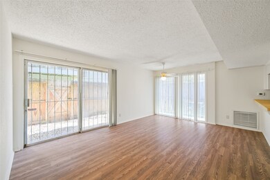 Natural light pours in from the large sliding glas