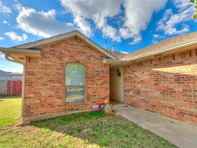 Doorway to property with a lawn