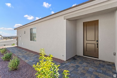 View of exterior entry with stucco siding