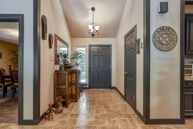 Entry into the home showing the Travertine Flooring and recent decorator paint.
