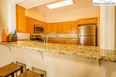 Converse with guests and family while preparing meals in the convenient kitchen workspace.  Informal meals are a breeze at the kitchen bar counter.