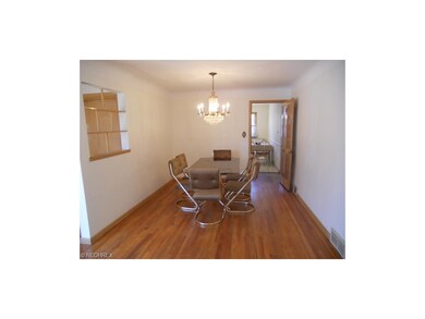 Expansive Formal Dining Room with Hardwood Floors