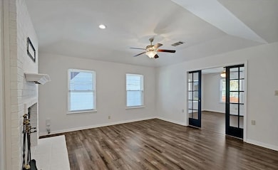 Unfurnished living room featuring french doors, d