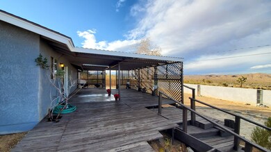 view of covered patio and backyard