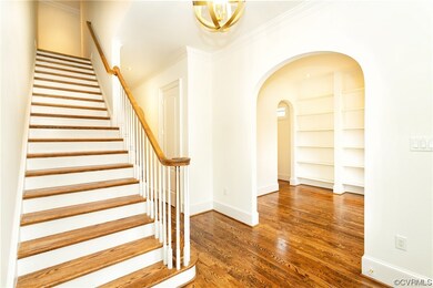 Stairway featuring built in shelves, dark wood-typ