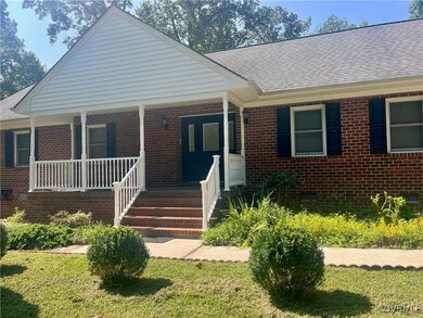 Bungalow with a front lawn and a porch