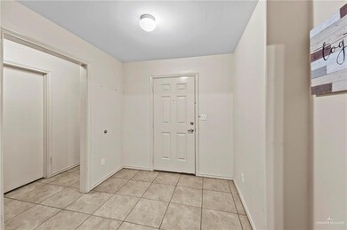 Entryway with light tile floors