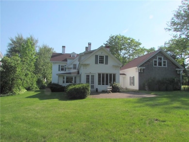 Looking at the back of the home, the...