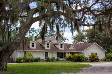 A perfect picture of the southern charm shaded with grand oaks of the circle drive entry.