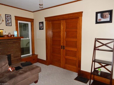 Living Room with beautiful wooden pocket doors to 