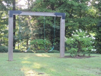 Swingset: Swingset is visible from the kitchen win
