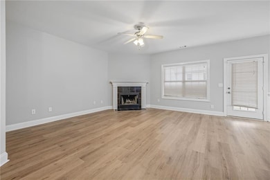 Unfurnished living room featuring light wood finis