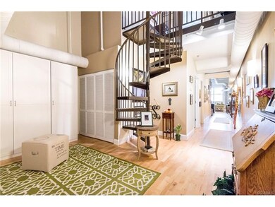 Gallery wall leads to living room and kitchen
