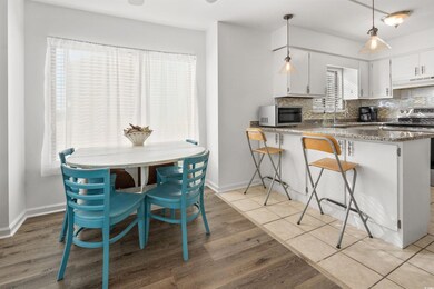 Kitchen featuring kitchen peninsula, appliances wi
