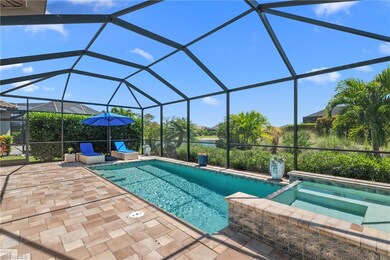 View of pool featuring glass enclosure and a patio