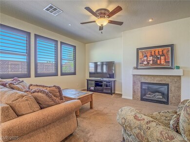 Living area featuring baseboards, a fireplace, a c