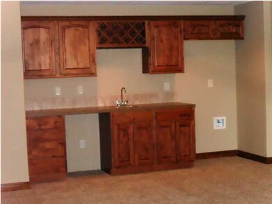 The wet bar in basement has space for full sized f